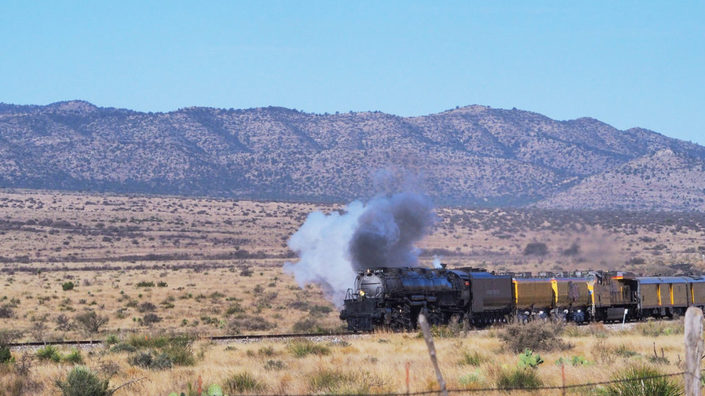 Hear them tracks a-hummin’, there's a train a-comin’