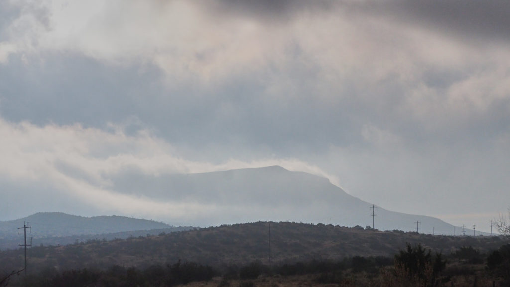 through rain sleet darkness wind,