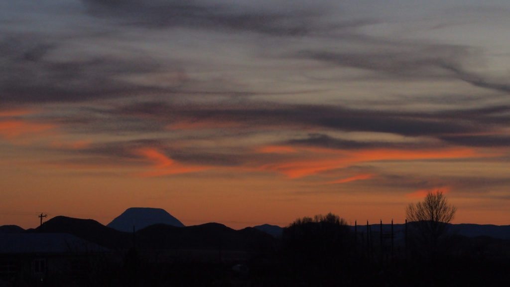 The earth beneath us moves, quiet and wild,