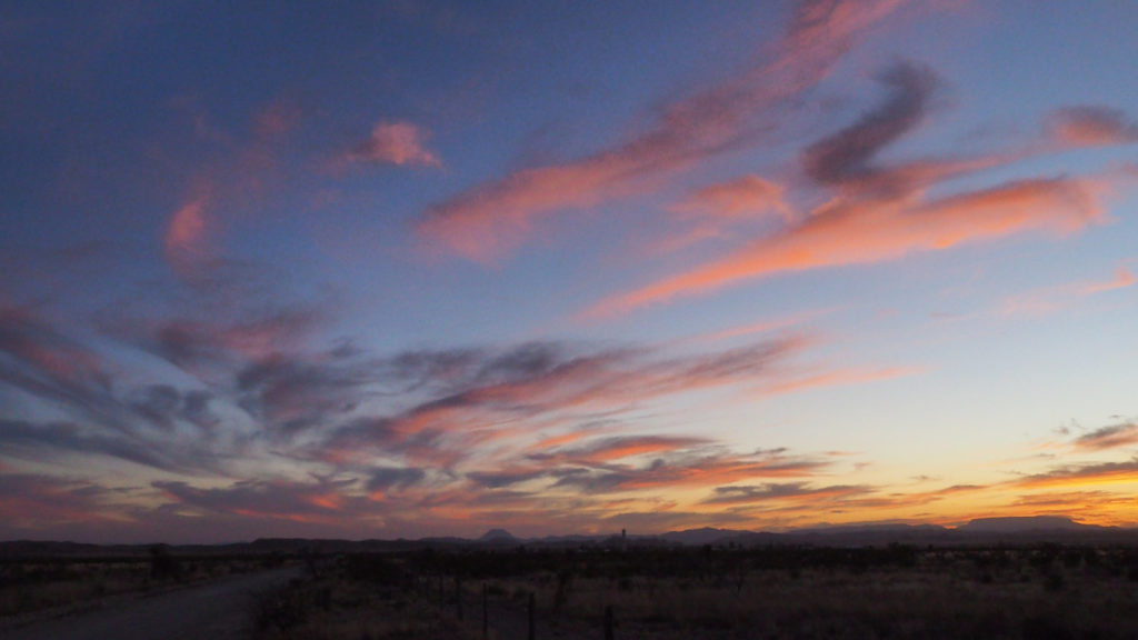 Months later, crossing moonlit fields