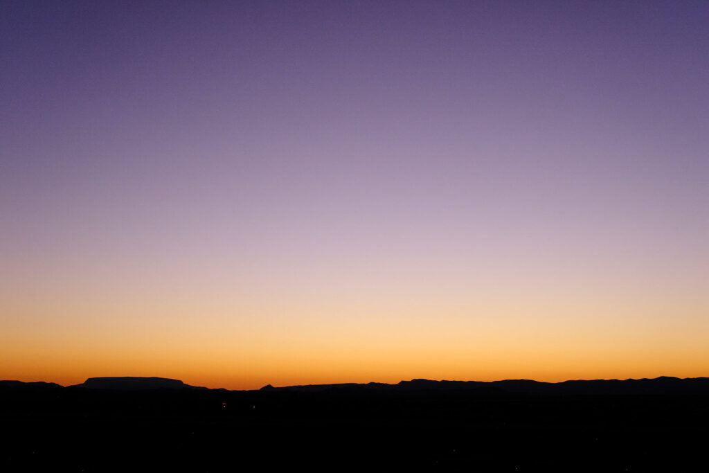 as a woman takes up her needles